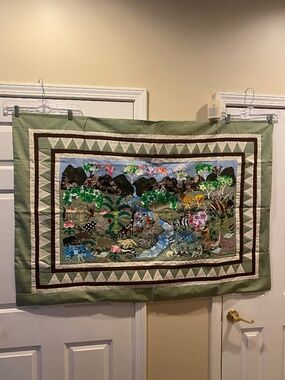 Quilt-style wall hanging with animal designs for decorating a child's room (New)